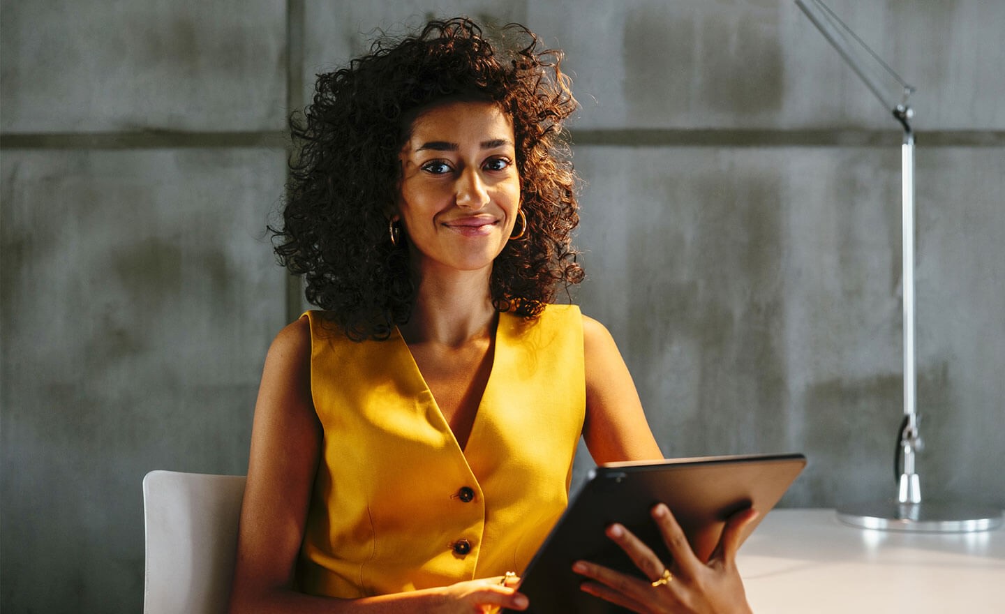 Confident leader at desk reviewing hiring data