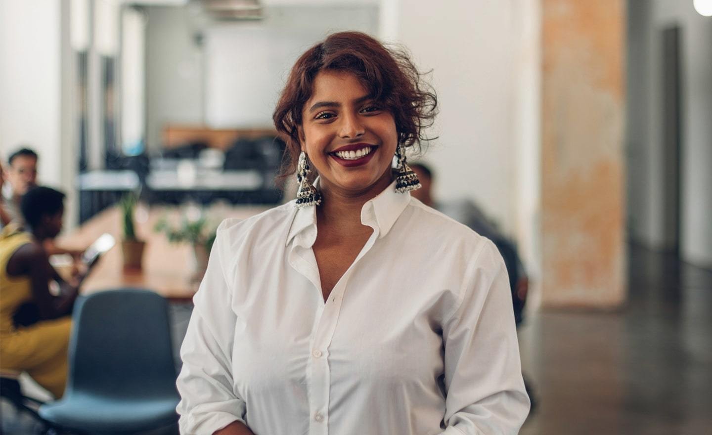 Happy woman working in office