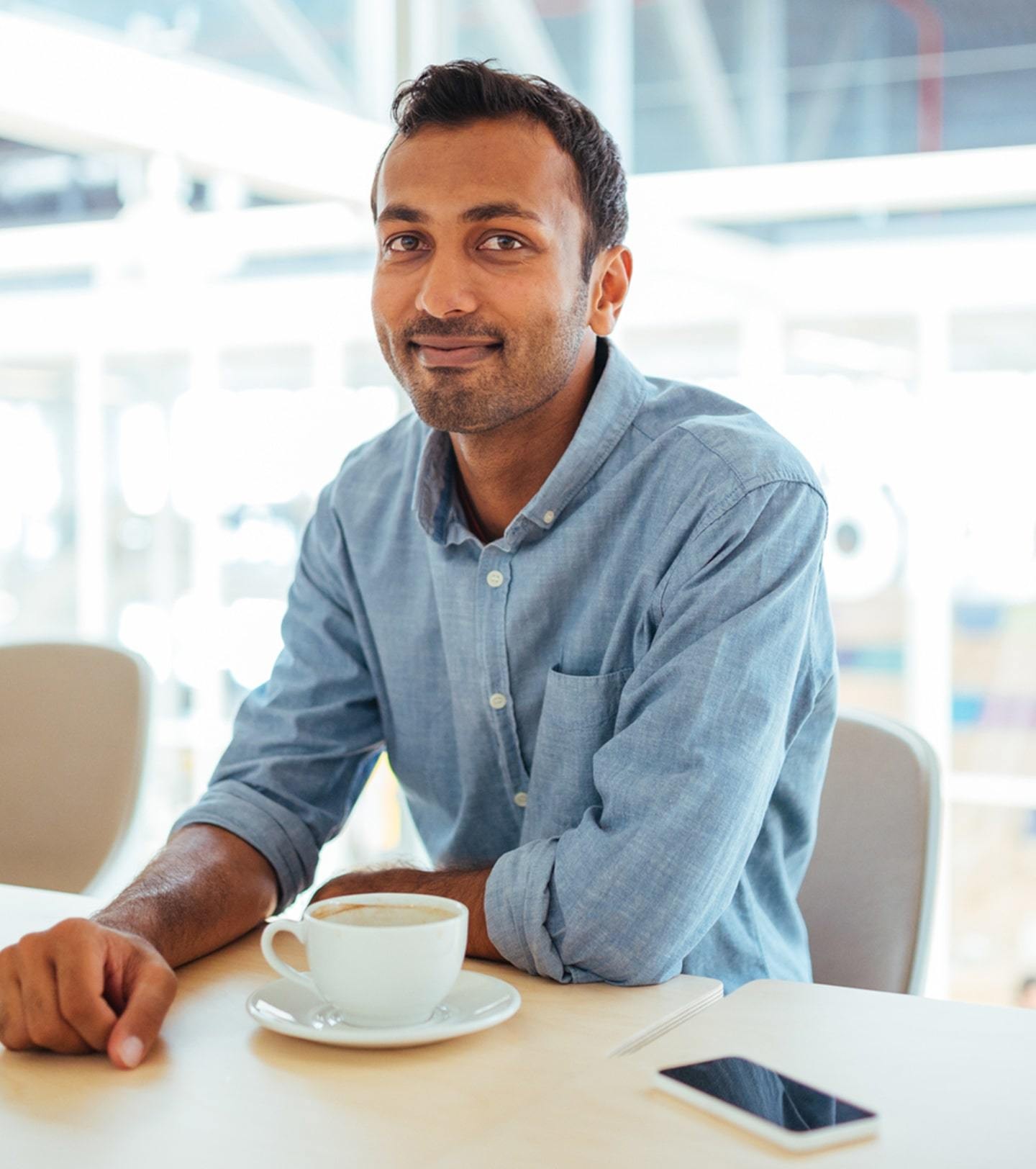 South Asian man in a conference room