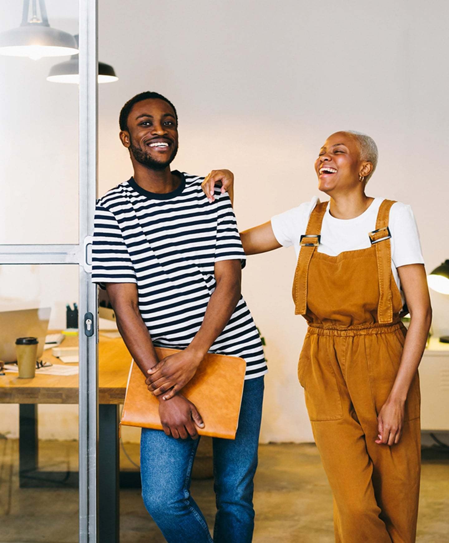 Two people standing in conference room