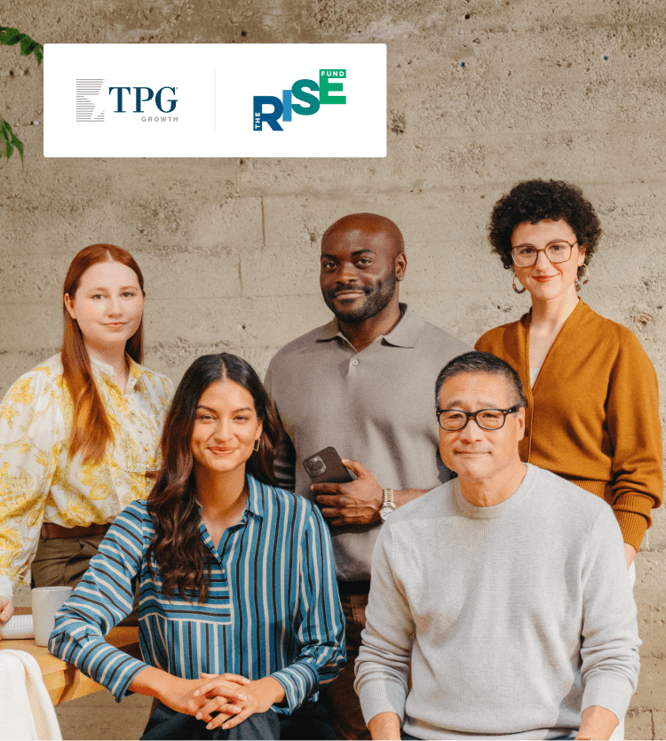 Group of coworkers gathered in warm office TPG and Rise Fund logos M